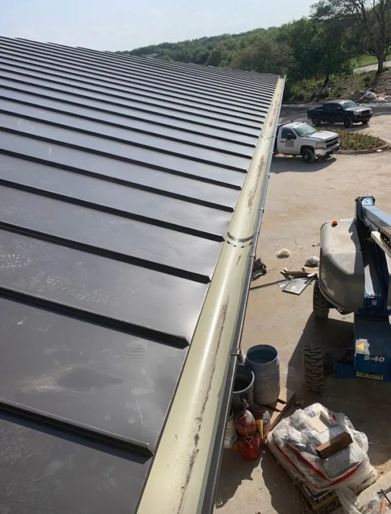 Standing seam panel and gutter detail on a metal roofing jobsite in Sonoma